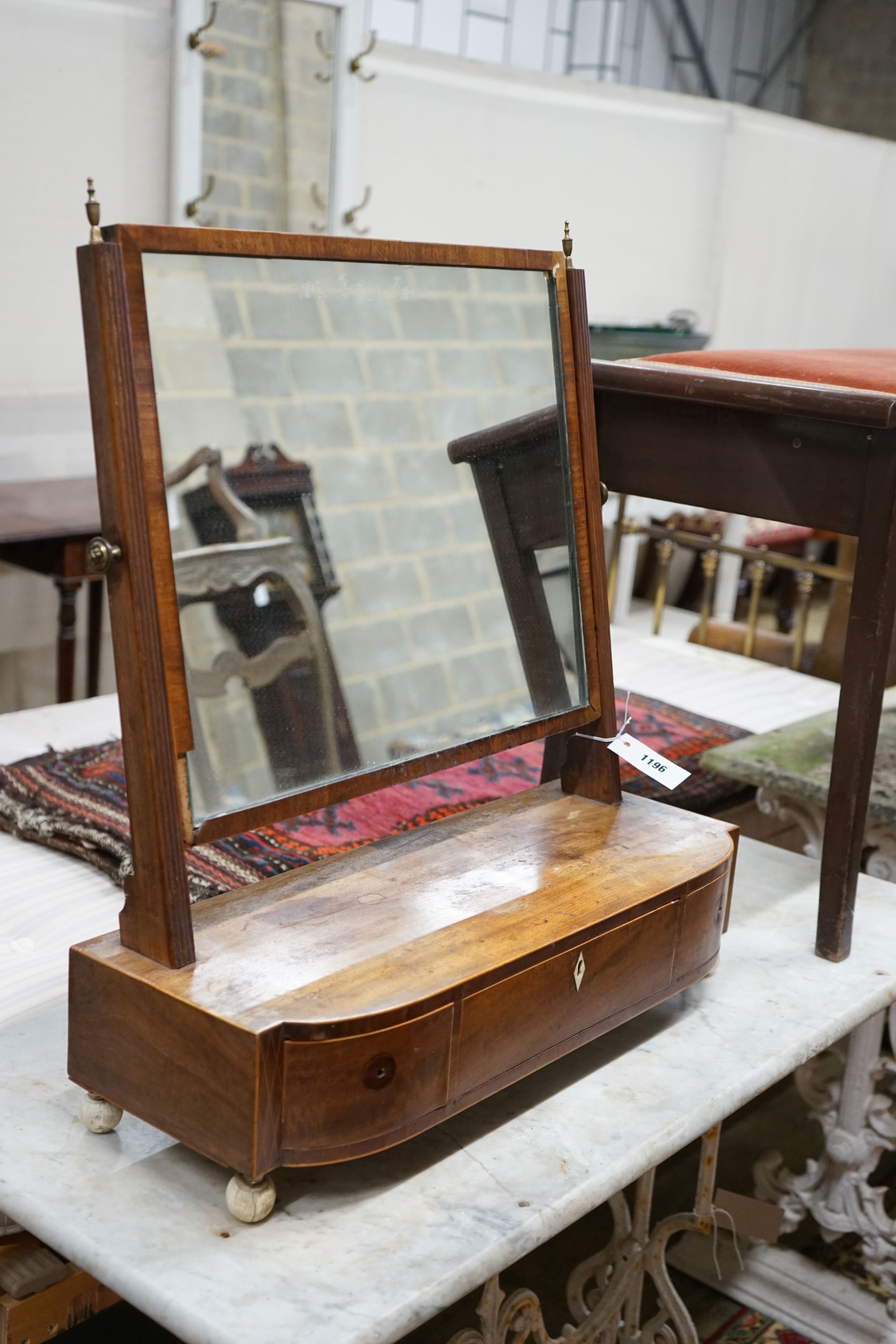 A Regency mahogany bow front box base toilet mirror, width 57cm, depth 22cm, height 65cm